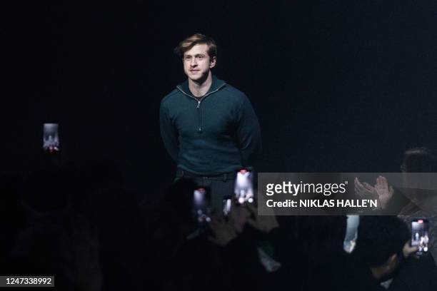 British fashion designer Daniel Lee acknowledges the audience at the end of the British fashion house Burberry Autumn/Winter 2023 fashion show...