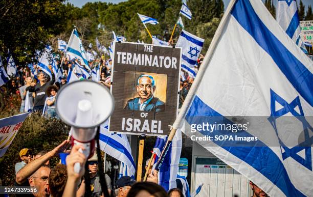 Protestors wave Israeli flags during a demonstration Mass demonstrations against the judicial reform were held in Jerusalem and Tel Aviv, while...