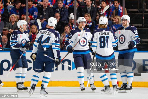 Pierre-Luc Dubois of the Winnipeg Jets celebrates with teammates after scoring a goal in the first period against the New York Rangers at Madison...