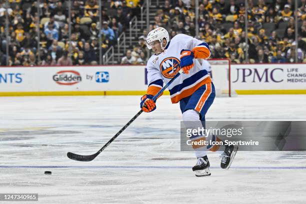 New York Islanders Right Wing Hudson Fasching shoots the puck ;during the second period in the NHL game between the Pittsburgh Penguins and the New...