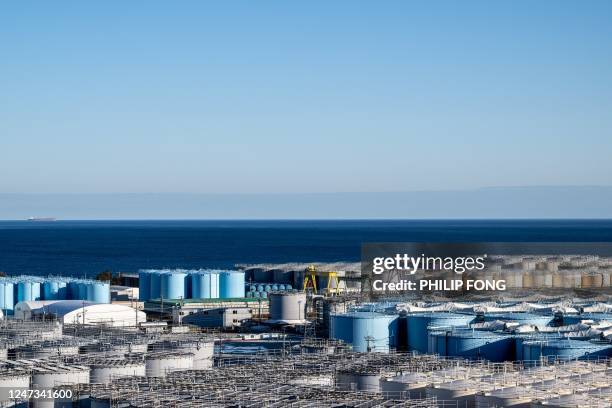 This picture taken on January 20, 2023 shows the storage tanks for contaminated water at the Tokyo Electric Power Company's Fukushima Daiichi nuclear...