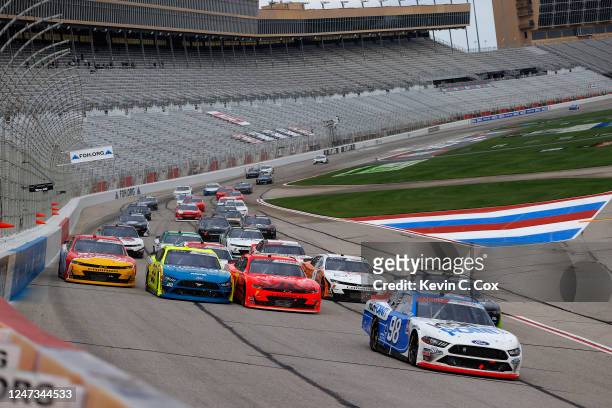 Chase Briscoe, driver of the HighPoint.com Ford, leads a pack of cars during the NASCAR Xfinity Series EchoPark 250 at Atlanta Motor Speedway on June...