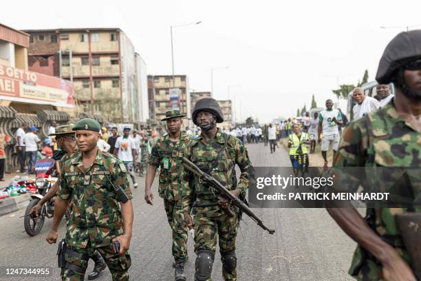 Nigeria army officers patrol during a rally for the All Progressives Congress presidential candidate Bola Ahmed Tinubu at Teslim Balogun Stadium in...