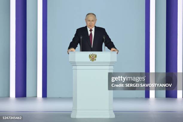 Russian President Vladimir Putin delivers his annual state of the nation address at the Gostiny Dvor conference centre in central Moscow on February...