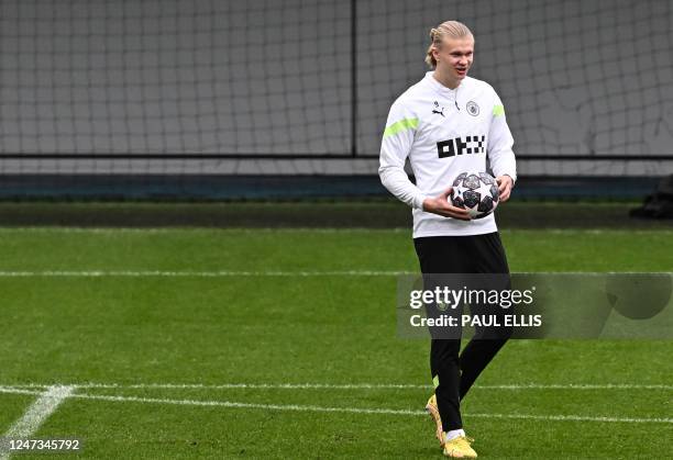 Manchester City's Norwegian striker Erling Haaland attends a team training session at Manchester City training ground in Manchester, north-west...