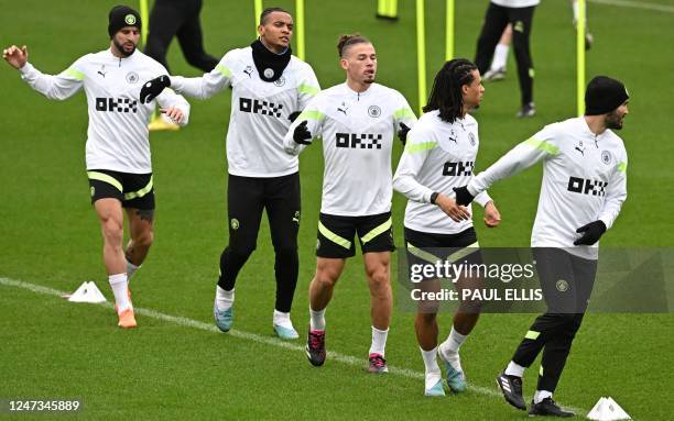Manchester City's English defender Kyle Walker, Manchester City's Swiss defender Manuel Akanji, Manchester City's English midfielder Kalvin Phillips,...