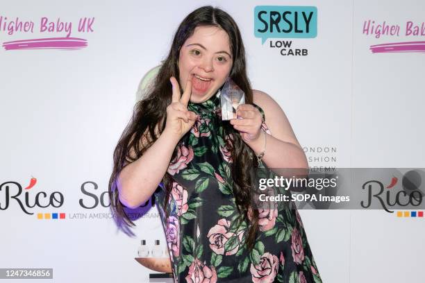 Model Ellie Goldstien poses with her Icon Award, Ellie made history being the first model with Down Syndrome to feature in huge campaigns. This Is...