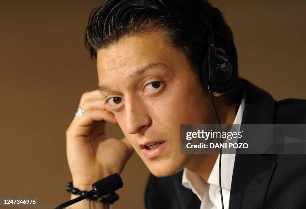 Real Madrid's new player Germany's midfielder Mesut Ozil gives a press conference at Santiago Bernabeu Stadium in Madrid on August 18, 2010. Germany...