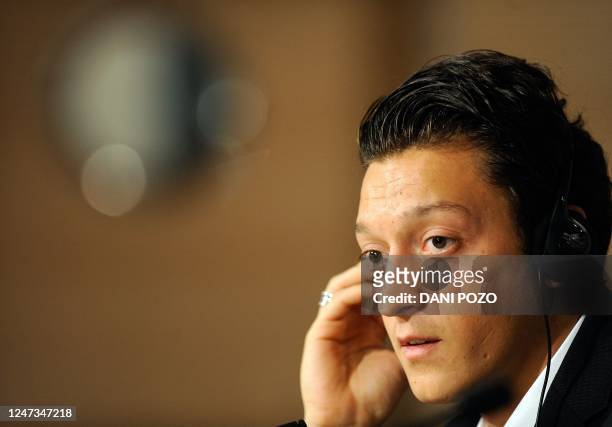 Real Madrid's new player Germany's midfielder Mesut Ozil gives a press conference at Santiago Bernabeu Stadium in Madrid on August 18, 2010. Germany...