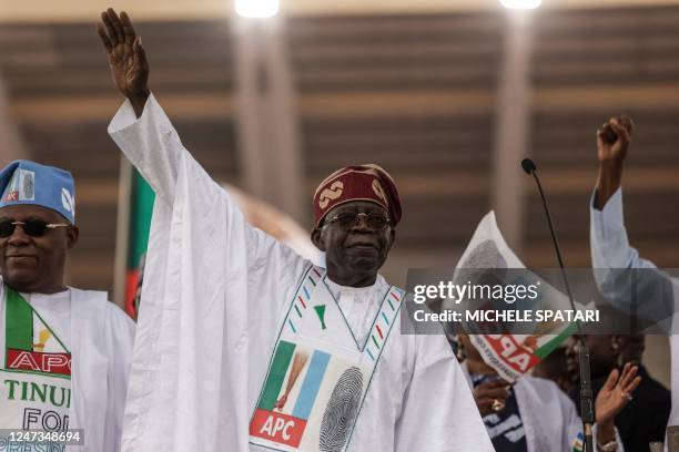 All Progressive Congress leader Bola Tinubu gestures towards the crowd during the APC party campaign rally at Teslim Balogun Stadium in Lagos on...