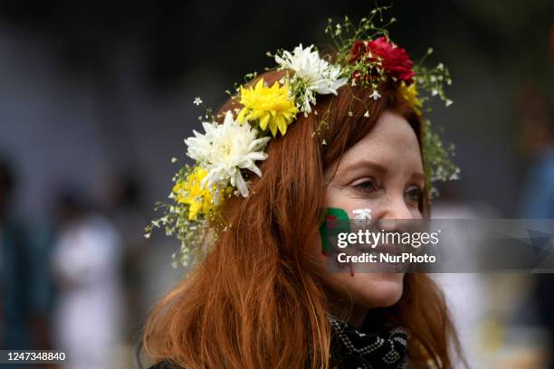 Foreign tourist participates in a function to pay homage at the Shaheed Minar, or Martyr's Monuments on International Mother Language Day in Dhaka,...