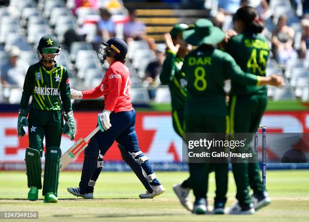 Alice Capsey of England is bowled by Sadia Iqbal of Pakistan during the ICC Women's T20 World Cup match between England and Pakistan at Newlands...