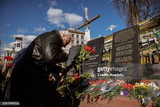 Professors from Conservatoite in Kyiv bring carnation flowers to Independece Square in the anniversary of Revolution of Dignity in Kyiv, Ukraine on...