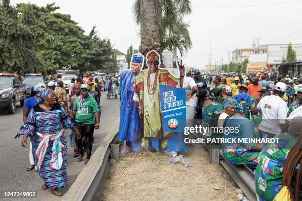 Supporters for the All Progressives Congress presidential candidate Bola Tinubu arrive at Teslim Balogun Stadium in Lagos on February 21, 2023 ahead...