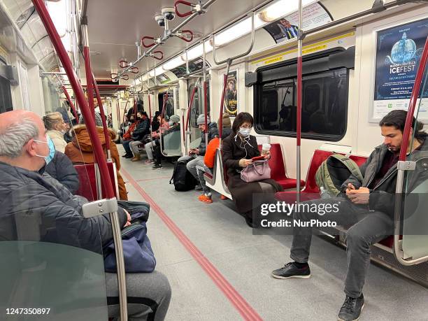 Riders on a TTC subway train in Toronto, Ontario, Canada, on February 19, 2023. Riders remain on edge as news came today that a suspect attempted to...