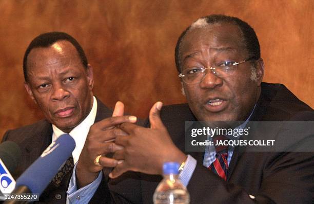 Democratic Republic of Congo opposition members Albert Ndele and Albert M'Peti answer questions 19 January 2001 in Brussels during a press conference...