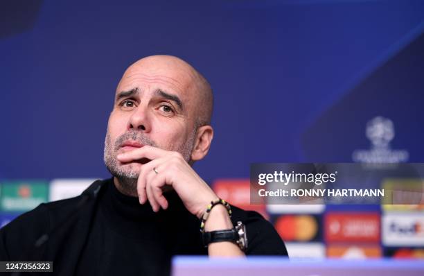 Manchester City's Spanish manager Pep Guardiola attends a press conference in Leipzig, eastern Germany on February 21 on the eve of their UEFA...