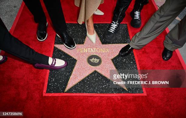 Members of US a cappella group Pentatonix pose for a photo with their newly unveiled Hollywood Walk of Fame star during a ceremony in Hollywood,...