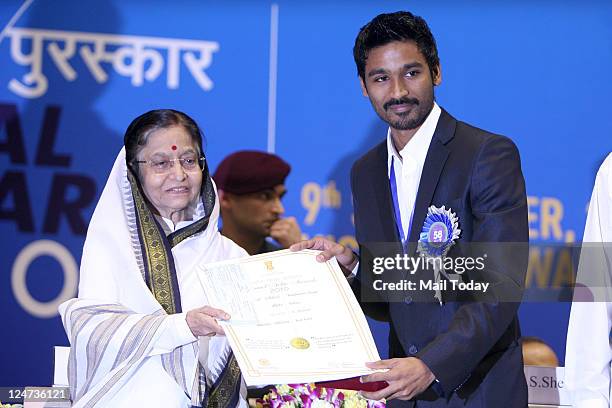 President Pratibha Patil presenting best actor award to K Dhanush award during the 58th National Film Awards Function in New Delhi on Friday.