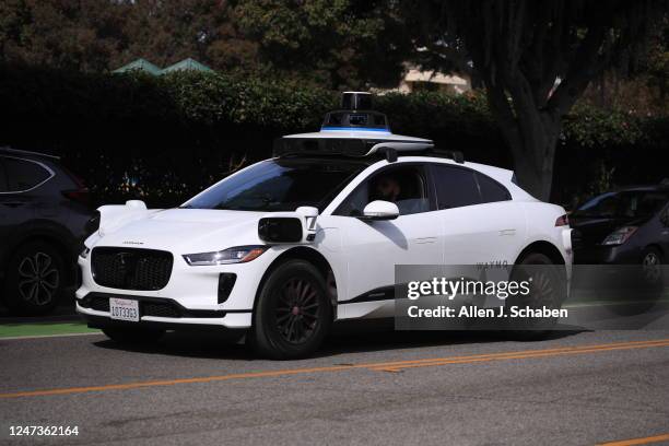 Santa Monica, CA Passengers ride in an electric Jaguar I-Pace car outfitted with Waymo full self-driving technology in Santa Monica Tuesday, Feb. 21,...