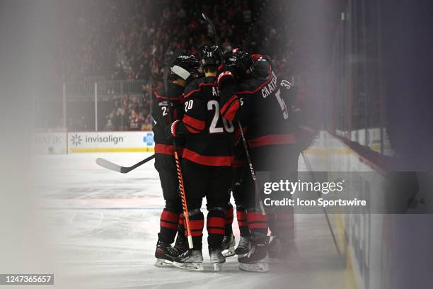 Members of the Carolina Hurricanes celebrate scoring a goal during the game between the St. Louis Blues and the Carolina Hurricanes on February 21,...