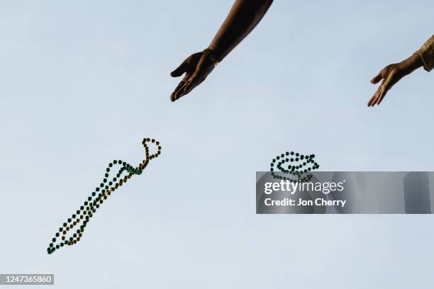 Mardi Gras participants throw beads to celebrants on Bourbon Street on February 21, 2023 in New Orleans, Louisiana. Fat Tuesday marks the last day of...