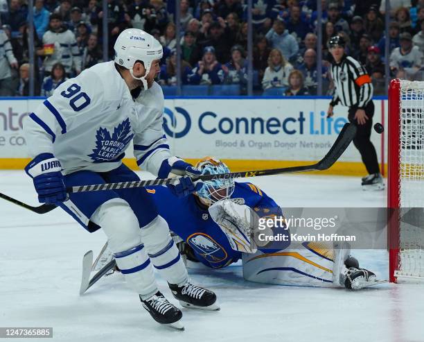 Ryan O'Reilly of the Toronto Maple Leafs scores his second goal of the first period against Ukko-Pekka Luukkonen of the Buffalo Sabres during the...