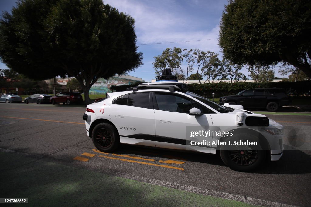 Self-driving Waymo cars on the road in Santa Monica
