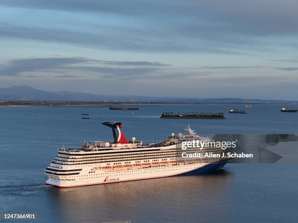 Long Beach, CA An aerial view of the Carnival Radiance, a Destiny-class cruise ship, as it heads out to sea in Long Beach at sunset Friday, Feb. 17,...