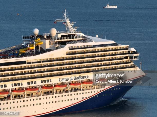 Long Beach, CA An aerial view of the Carnival Radiance, a Destiny-class cruise ship, as it heads out to sea in Long Beach at sunset Friday, Feb. 17,...