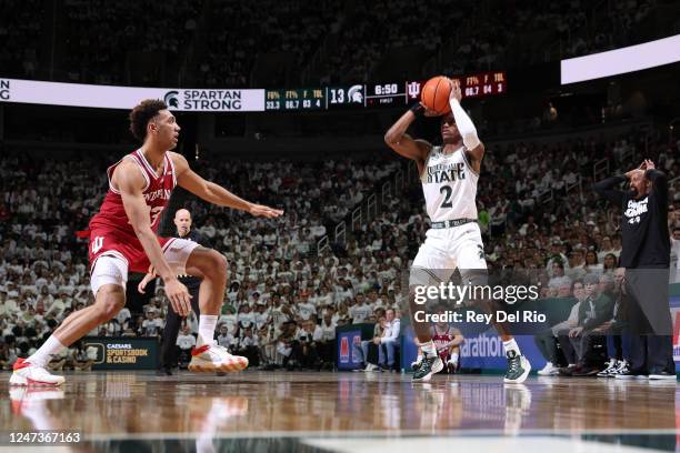 Tyson Walker of the Michigan State Spartans looks to shoot the ball while defended by Trayce Jackson-Davis of the Indiana Hoosiers during the first...