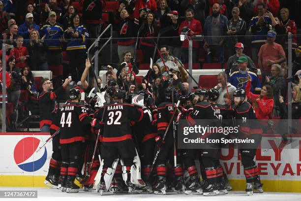 Members of the Carolina Hurricanes celebrate winning after the game between the St. Louis Blues and the Carolina Hurricanes on February 21, 2023 at...