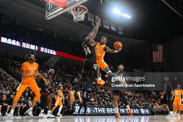 Texas A&M Aggies forward Julius Marble attempts to block a shot attempt by Tennessee Volunteers guard Jahmai Mashack during the basketball game...