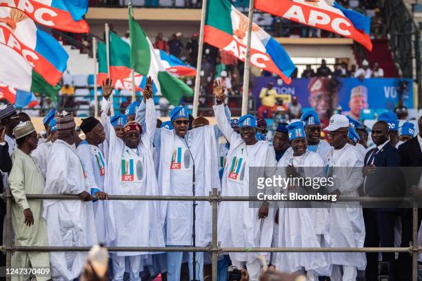 Bola Tinubu, presidential candidate for the All Progressive Congress , center left, Muhammadu Buhari, Nigeria's president, center, and Jide...
