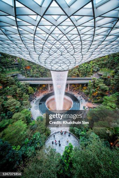 the rain vortex in jewel changi airport - theme park singapore stock pictures, royalty-free photos & images