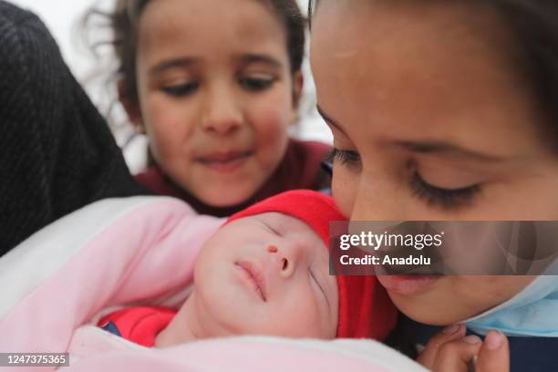 An infant pulled alive from earthquake-shattered home in Jinderis town arrives new home after being discharged from a hospital in Afrin district of...