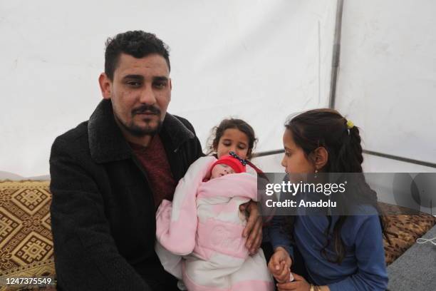 An infant pulled alive from earthquake-shattered home in Jinderis town arrives new home after being discharged from a hospital in Afrin district of...