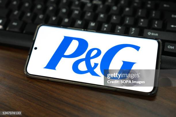 In this photo illustration, a Procter & Gamble logo is displayed on the screen of a smartphone.