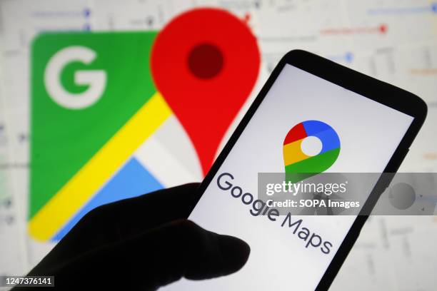 In this photo illustration, the Google Maps logo is seen on a smartphone screen.