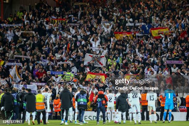 Real Madrid fans celebrate their players after the UEFA Champions League round of 16 leg one match between Liverpool FC and Real Madrid at Anfield on...