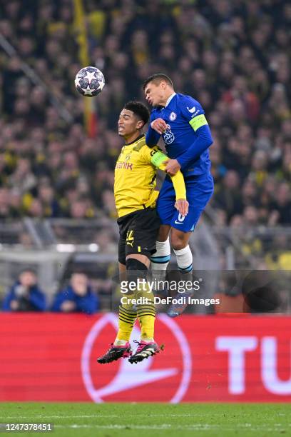 Jude Bellingham of Borussia Dortmund and Thiago Silva of Chelsea FC battle for the ball during the UEFA Champions League round of 16 leg one match...