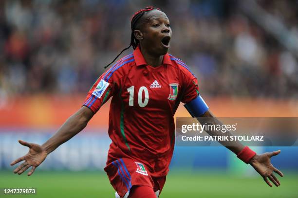 Equatorial Guinea's midfielder Anonman celebrates after scoring the 1-1 during the Group D football match of the FIFA women's football World Cup...