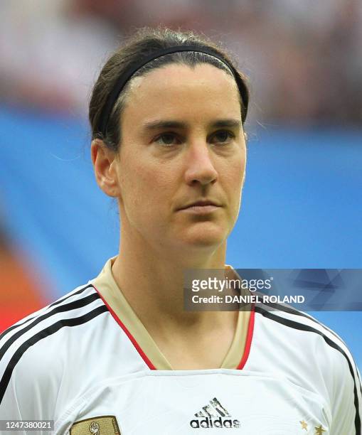 Germany's Birgit Prinz stands for the national anthems before the group A match of the FIFA women's football World Cup Germany vs Nigeria on June 30,...