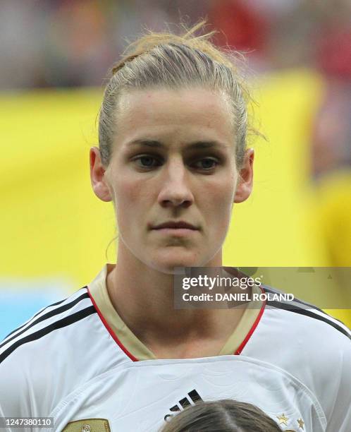 Germany's Simone Laudehr stands for the national anthems before the group A match of the FIFA women's football World Cup Germany vs Nigeria on June...