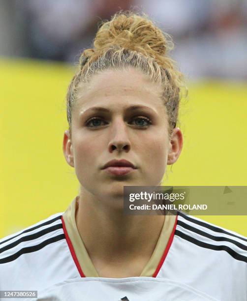 Germany's Kim Kulig stands for the national anthems before the group A match of the FIFA women's football World Cup Germany vs Nigeria on June 30,...