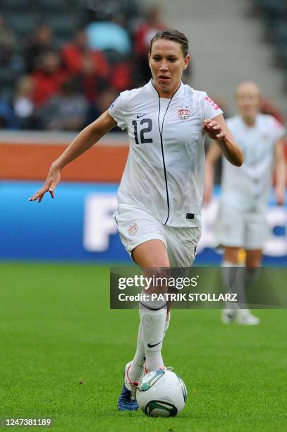 S striker Lauren Cheney, scorer of the US' first goal, plays the ball during the FIFA women's football World Cup semi-final match France vs USA in...