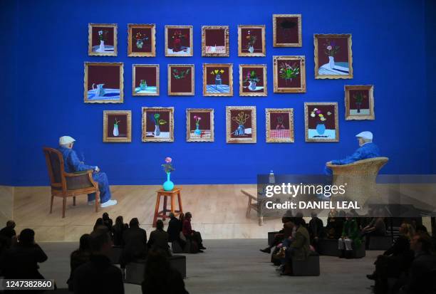 Visitors attend the 'David Hockney: Bigger & Closer immersive exhibition at the Lightroom gallery in London on February 22, 2023. - David Hockney's...