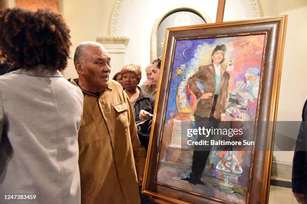 Lawrence Lacks, the oldest son of Henrietta Lacks, looks at a portrait of his mother during an unveiling in the Baltimore City Hall rotunda. Lacks'...