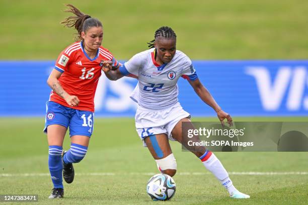 Isidora Olave of Chile National Women's soccer team and Roselord Borgella of Haiti National Women's soccer team seen in action during the FIFA...