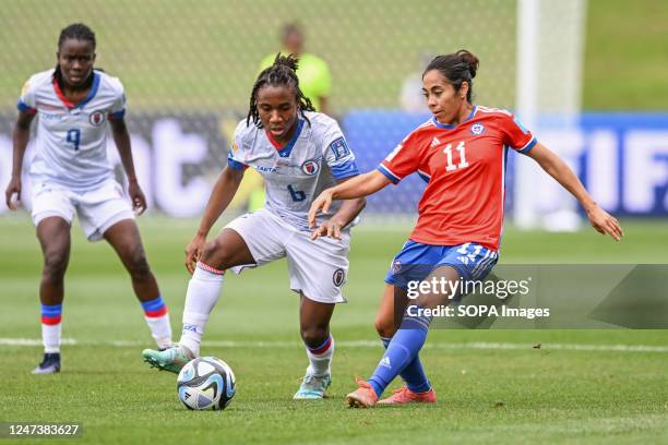 Melchie Dumonay of Haiti National Women's soccer team and Yessenia Lopez of Chile National Women's soccer team seen in action during the FIFA Women's...